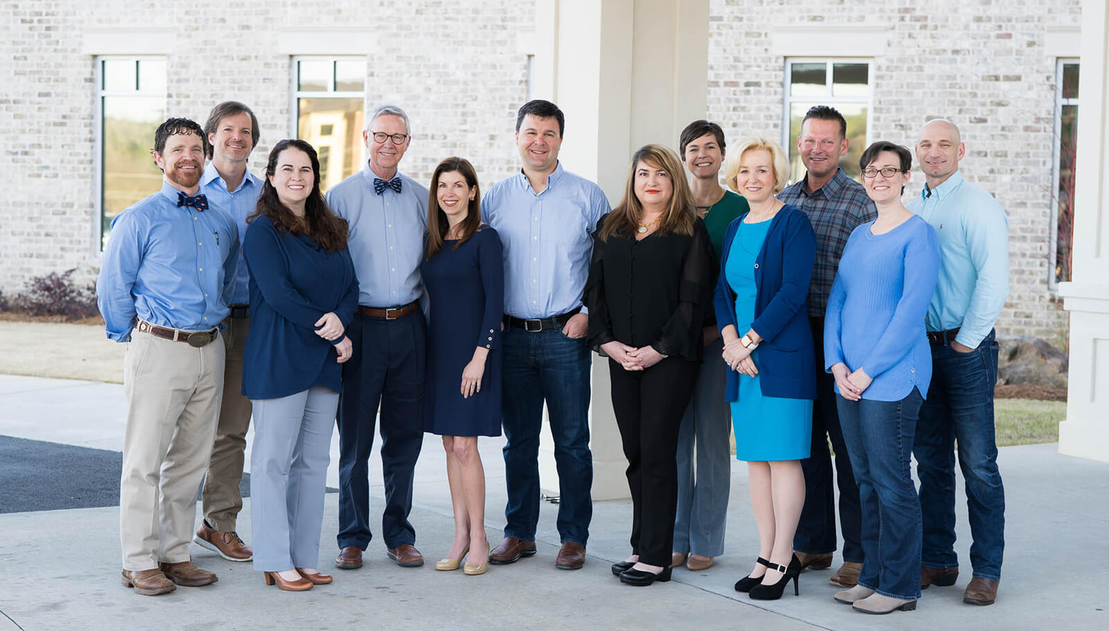 group photo of the Primary Pediatrics team smiling out side of the Macon office